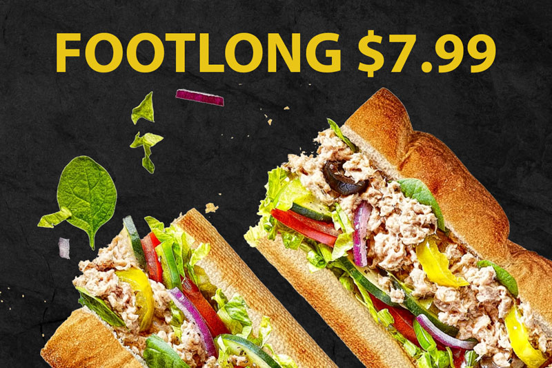A footlong tuna sandwich with lettuce, tomatoes, peppers, and onions for $7.99